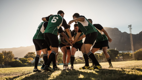Rugby players huddling